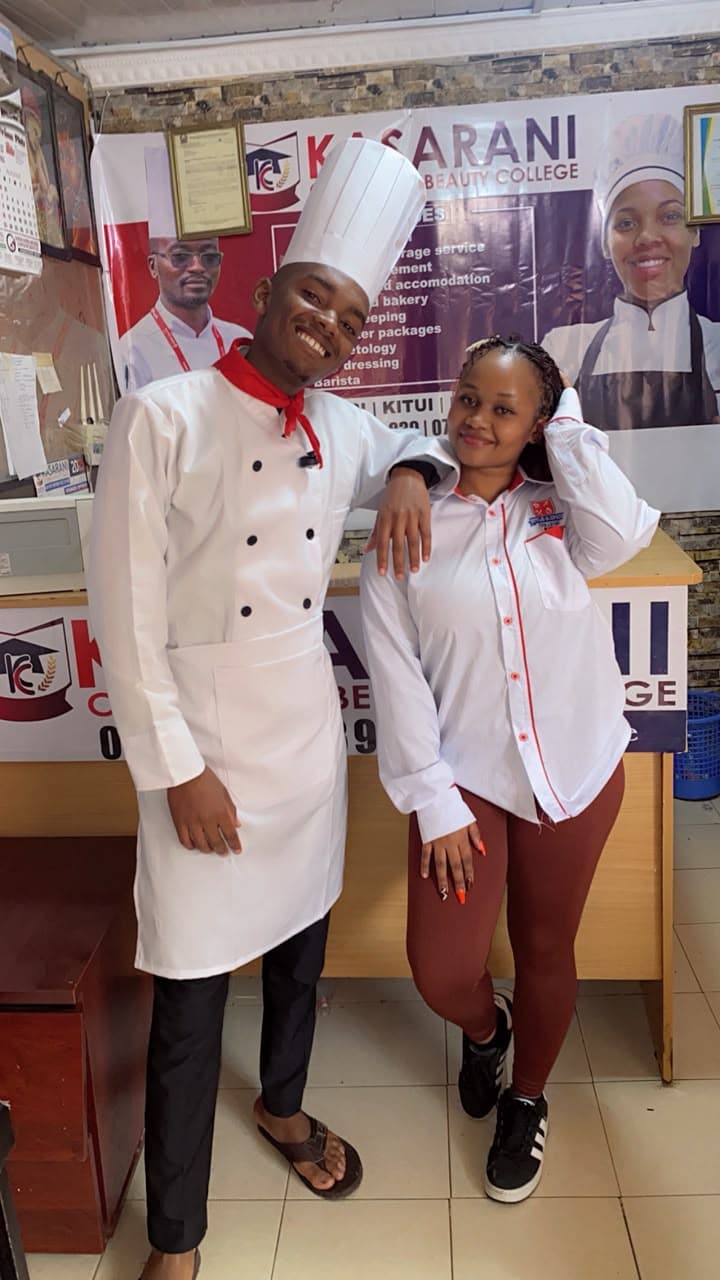 A KCBC chef and front office student sharing a laugh